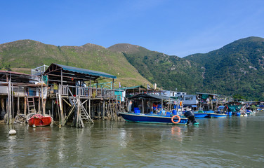 Fototapeta na wymiar Boats in Tai O village. Tai O is a fishing town, located on the western side of Lantau Island in Hong Kong.