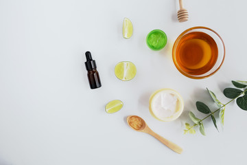 Wellness cosmetic package containers with green leaves, natural herbal ingredient. natural organic beauty product concept mock up. Blank bottle for label own branding skincare. isolated white backgrou