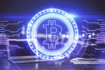 Multi exposure of blockchain theme hologram and table with computer background. Concept of bitcoin crypto currency.