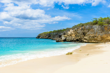 Little Knip beach - paradise white sand Beach with blue sky and crystal clear blue water in Curacao, Netherlands Antilles, a Caribbean tropical Island
