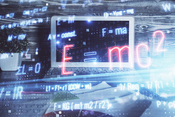 Desktop computer background and formula hologram writing. Double exposure. Education concept.