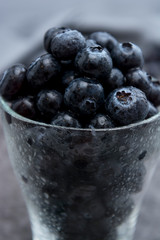 Blueberries in glass cup, selective focus. Blueberries isolated.