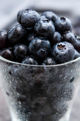 Blueberries in glass cup, selective focus. Blueberries isolated.