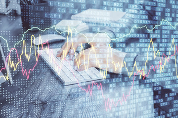 Multi exposure of market chart with man working on computer on background. Concept of financial analysis.
