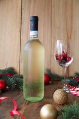 Wine and Christmas Decor on a wooden background