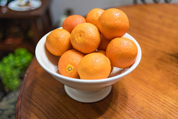 Oranges in White Bowl