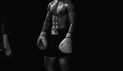 Fototapeta na wymiar Black and white photo of boxing athlete the body.