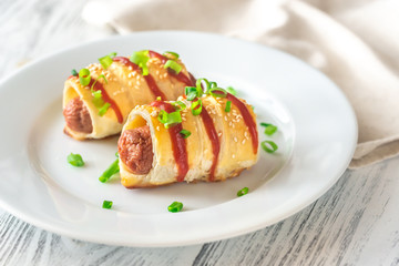 Sausage rolls on the white plate