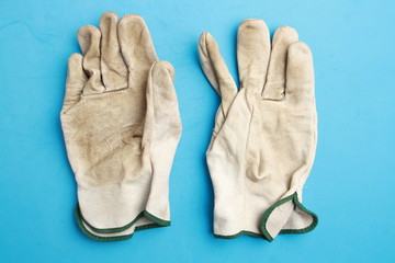 used leather work gloves in color background