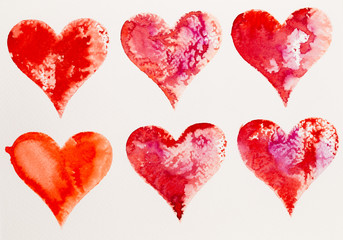 Watercolor painted pink heart, on the white watercolor paper.