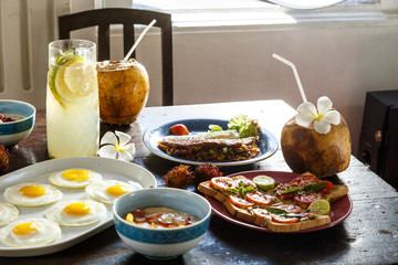 Diet menu. Healthy lifestyle on wooden old table . coconut, eggs, oatmeal, sandwich, vegetables, salad served with simple plates.