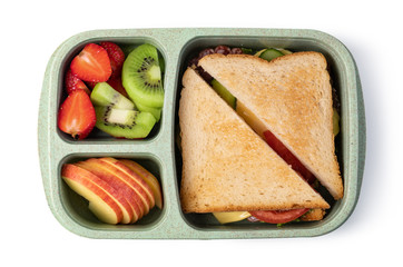 Lunch box with delicious food on a white background