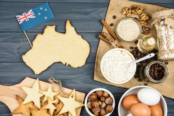 cooking patriotic cookies, gingerbread in shape of Australia. Celebrate Australia Day holiday on...