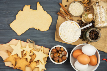 Fototapeta na wymiar cooking patriotic cookies, gingerbread in shape of Australia. Celebrate Australia Day holiday on January 26