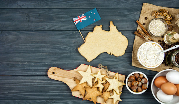 cooking patriotic cookies, gingerbread in shape of Australia. Celebrate Australia Day holiday on January 26