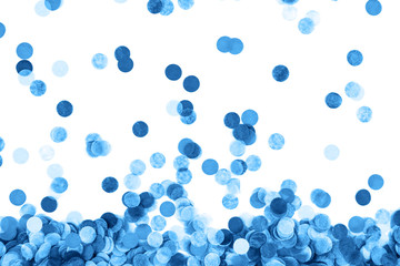 Blue confetti background. Flat lay style. Festive concept