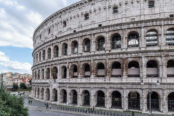 Fototapeta na wymiar ROME, ITALY - DECEMBER 01, 2019: Ancient Roman Colosseum, best known architecture and landmark in Rome, Italy. People visit the famous Colosseum in Roma center.