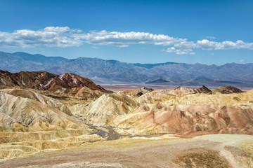 Fototapeta na wymiar Zabriskie Point, this short hike to a spectacular view is one of the park's most famous in Death Valley, USA