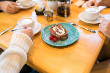 Woman Enjoying Sweet Food And Beverage In Cafe