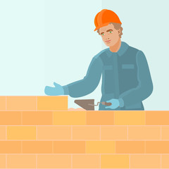 construction worker dressed in blue uniform and orange helmet holds trowel in hand and builds a brick wall