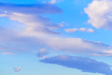 Dramatic puffy clouds isolated against blue skies