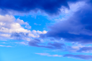Dramatic puffy clouds isolated against blue skies