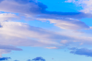 Dramatic puffy clouds isolated against blue skies
