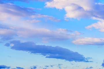 Dramatic puffy clouds isolated against blue skies