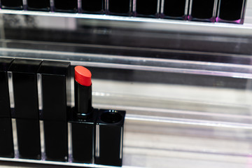 The lipstick in the black suqare shape container