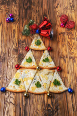 christmas pizza on wooden background