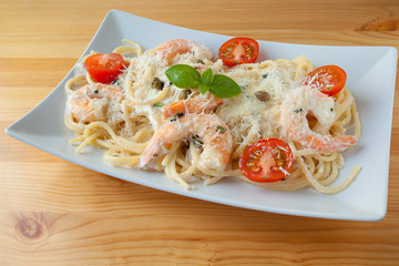 delicious green tagliatelle isolated on white