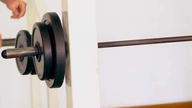 Athletic man preparing to do weightlifting