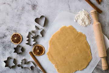 Cooking Christmas gingerbread cookies on a gray background