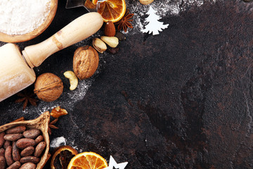 Baking christmas cookies. Typical cinnamon stars bakery with spices. xmas decoration on table