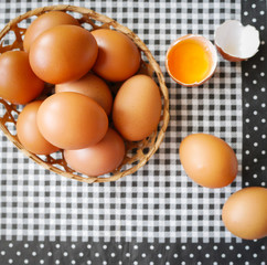 Healthy food, Fresh brown chicken eggs in basket on paper tray pattern  background