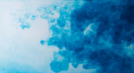 Blurred colors are melting in water to be blue background