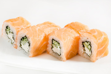 Sushi with seafood and vegetables on a white background in the restaurant 