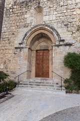 Entrance doors to the Benedictine Abbey of Abu Gosh in the Chechen village Abu Ghosh near Jerusalem in Israel