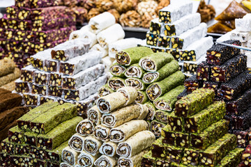 Background sweets baklava turkish delight nuts in the oriental market.