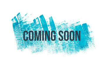 Coming soon on blue paint background, isolated on white. Advertising banner concept.