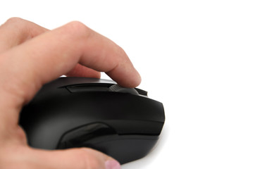 black computer mouse in hand isolated on a white background. Close-up.