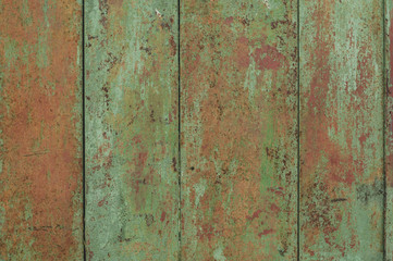 vertical aged rusty green with orange wooden board for tamplate, background and banner