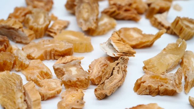 side view herb medicine BaiBu or Stemonae Radix or Japanese Stemona Root rotate and pause