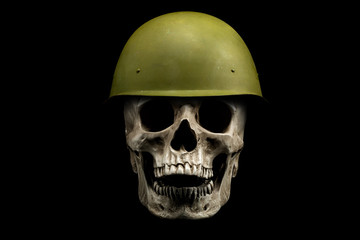 Human skull in military helmet isolated on black background. War concept. 