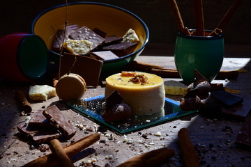 Delicious pudding surrounded by assorted traditional sweets