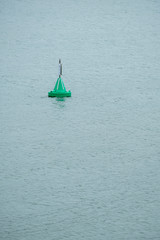 Bouy in the water floating and providing direction 