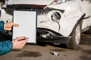 Space for text, blank document close up. An insurance agent will inspect and inspect vehicle damage after an accident.