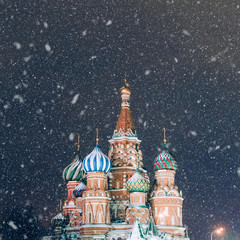 Night winter photo of cathedral of Vasily the Blessed on Red Square. Saint Basil's church during a snowfall. Main Christian Cathedral in Russian Federation. Pokrovsky Cathedral is symbol of Russia.