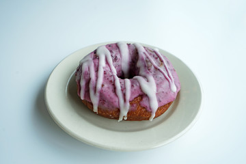 Close up blueberry glazed cake donut