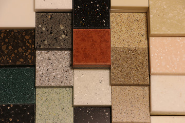 Top view of color samples stone  on oak wood table, Acrylic Solid Surface
